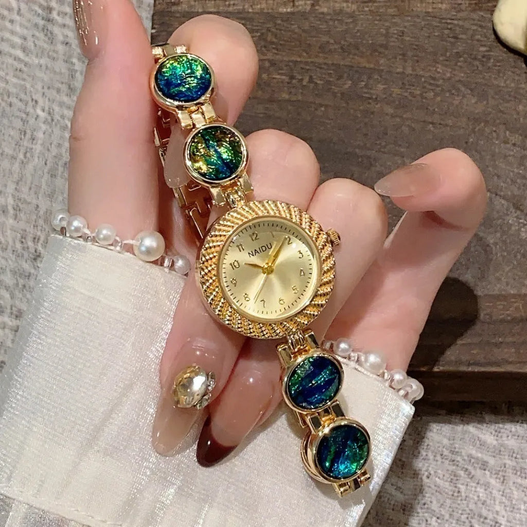 Women's quartz watch with 25mm round dial and zinc alloy case in one of six colours.