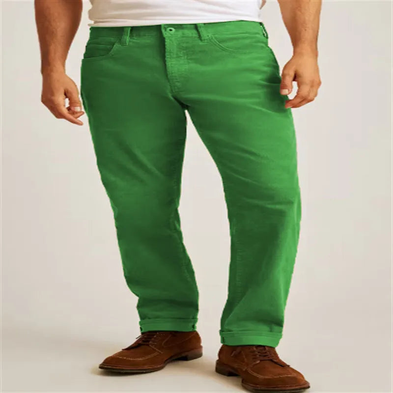 Corduroy straight-leg trousers in green displayed flat showing mid-waist design and zip fly