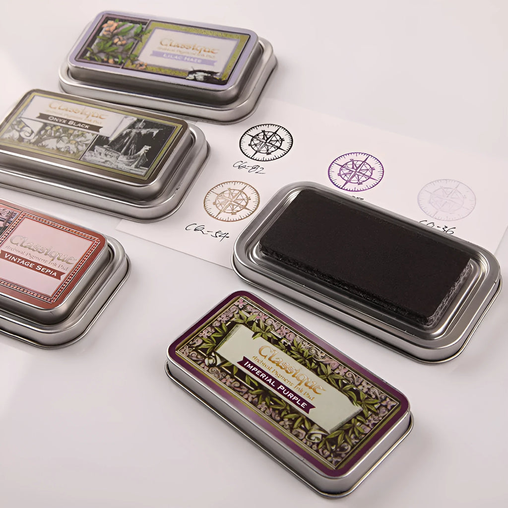 Rectangular stamp pad with oily ink in cocoa brown, fog blue, gray pink, green, and leaf green options