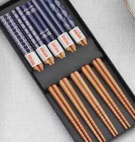 Set of five pairs of bamboo chopsticks with Japanese cartoon patterns in a gift box.