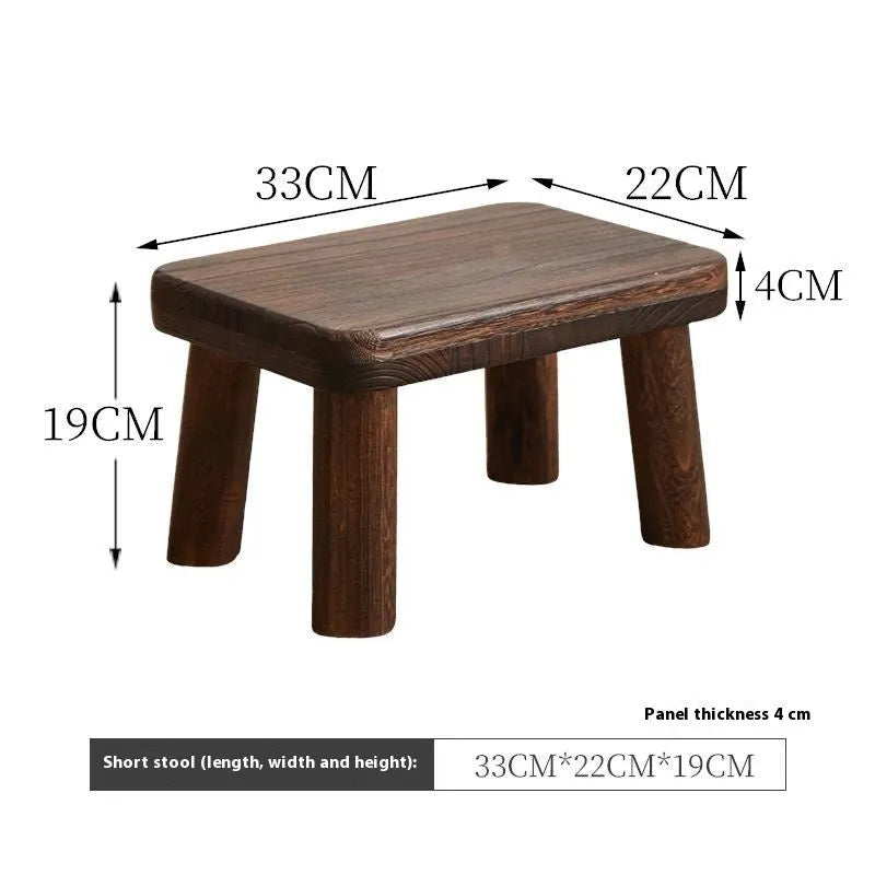 Distressed solid wood changing stool with bracket structure for hallway or living room.