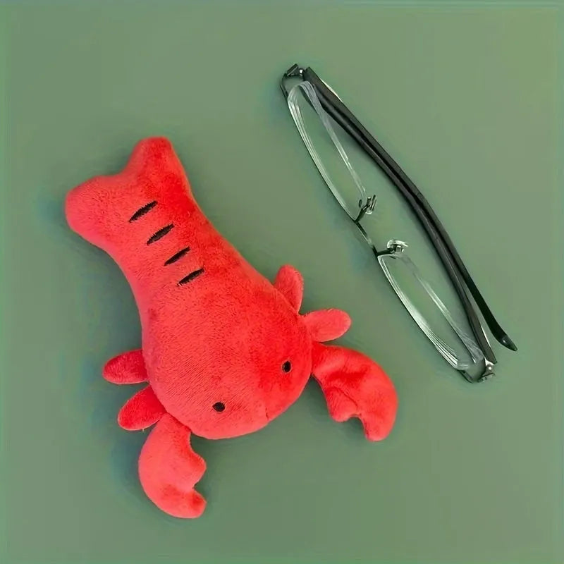 Red lobster-shaped squeaky plush dog toy for small and medium breeds.