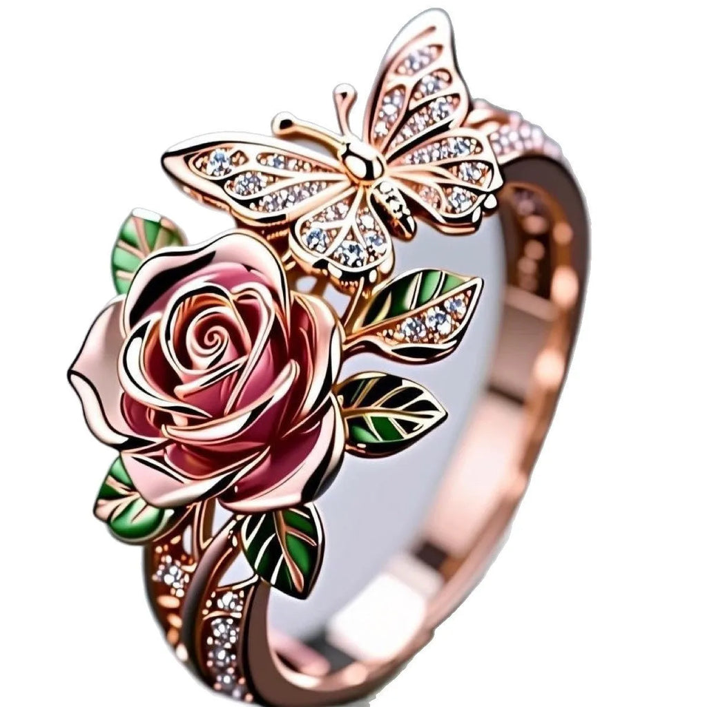 Close-up of an adjustable fairy style ring with a colourful oil-drip butterfly, rose, and leaf design in alloy.