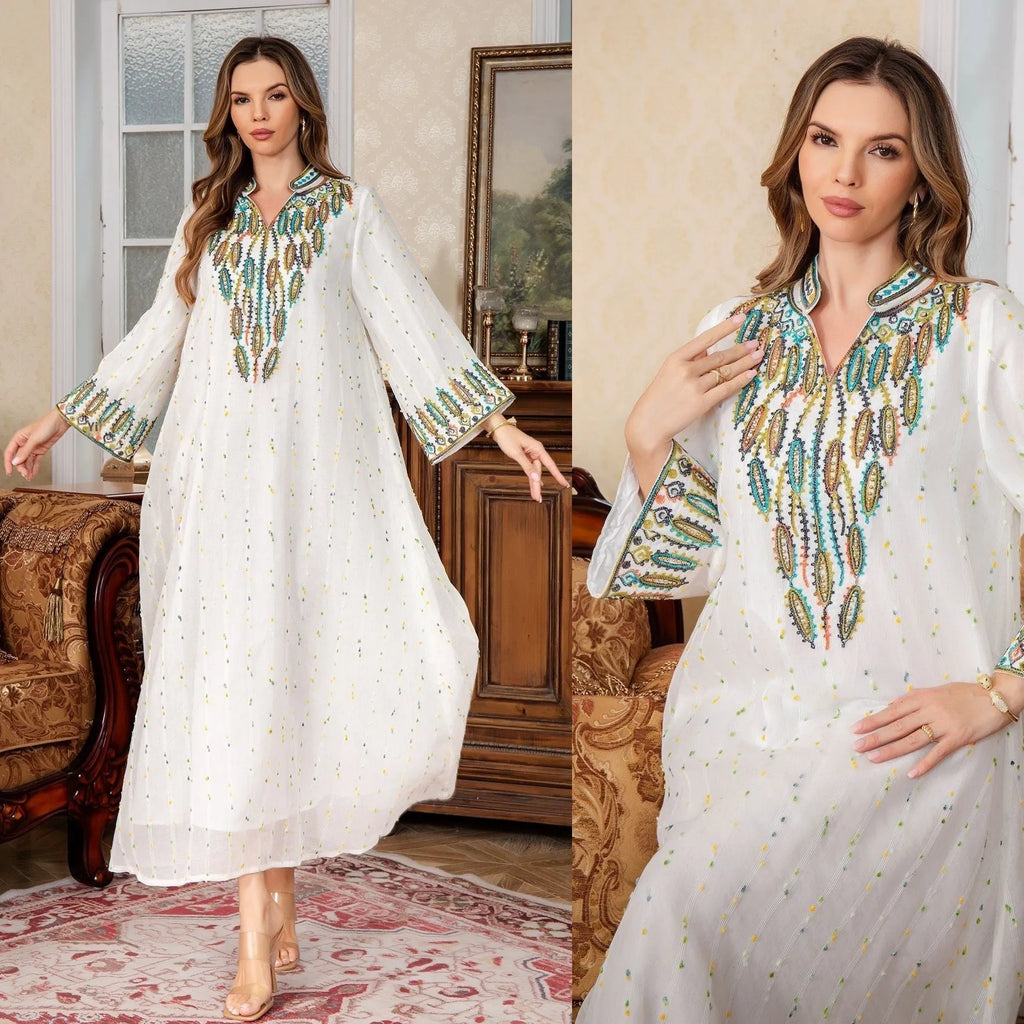 White Dubai-style Arabic robe with long sleeves and full-length skirt on hanger
