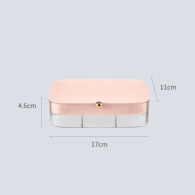Modern minimalist green jewellery storage box with multi-layer compartments open on a dressing table.