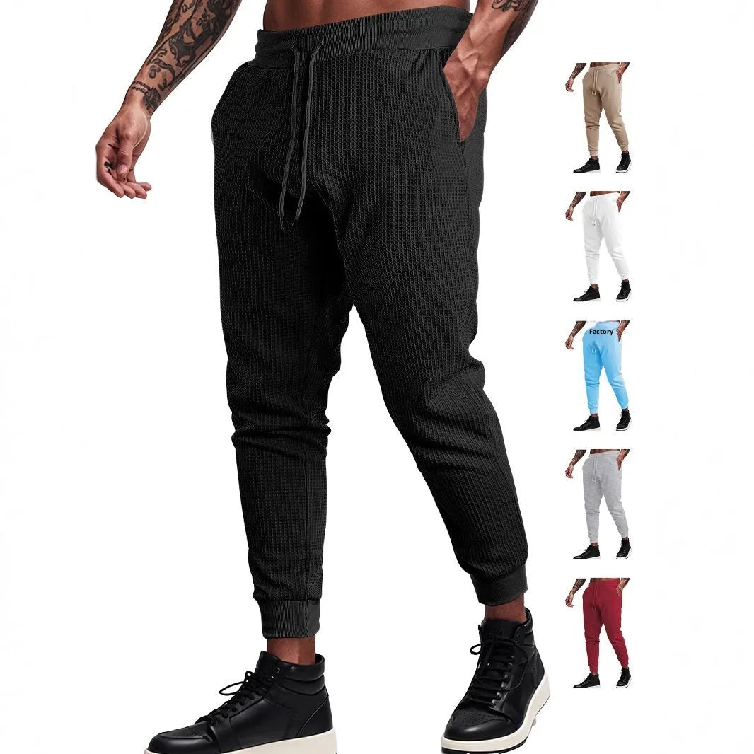 Men's casual loose solid colour drawstring pants in waffle knit polyester, front view