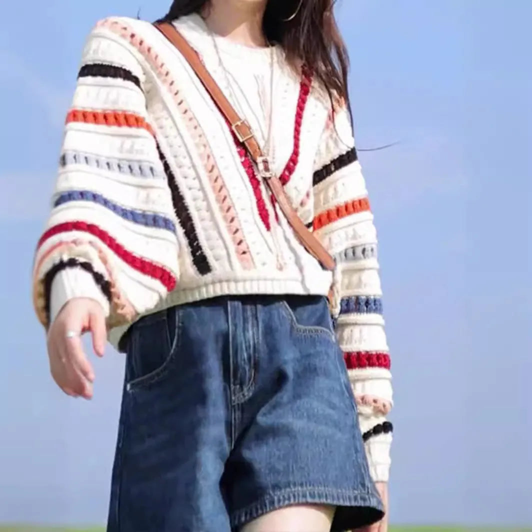 Rainbow striped hollow knit sweater with batwing sleeves and round neck
