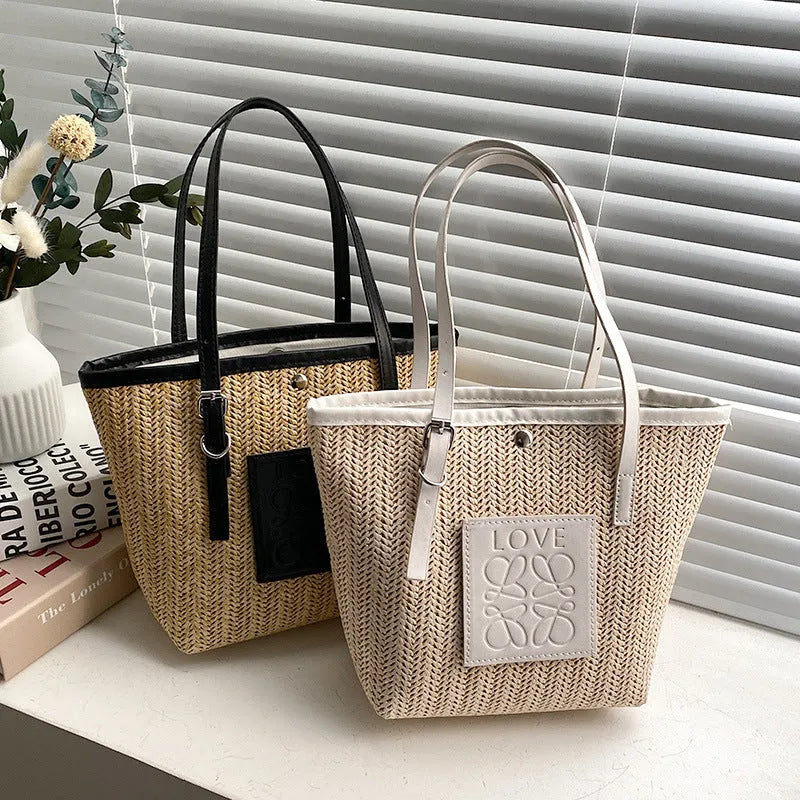 Straw woven women's shoulder bag in black with three-dimensional pocket and 27cm width