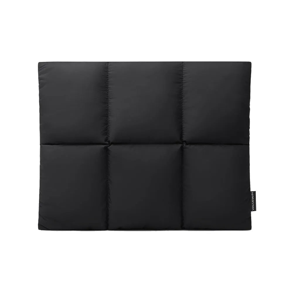 Soft black polyester laptop sleeve for 13-15.6 inch laptops on a table.