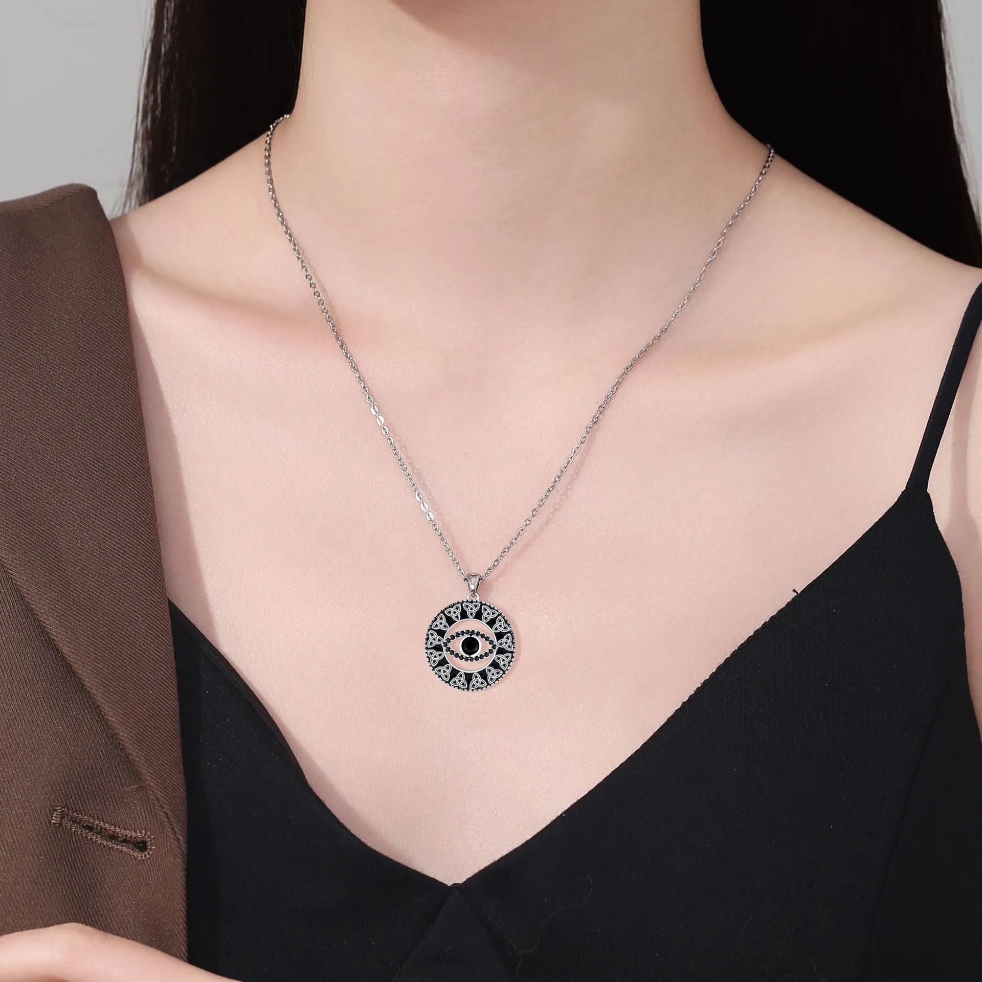 Copper Devil's Eye pendant necklace with a cross chain for women.