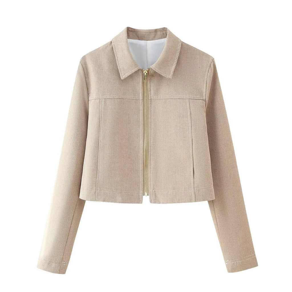 Women's beige herringbone pattern jacket and trousers suit set with 3D embroidery detail.