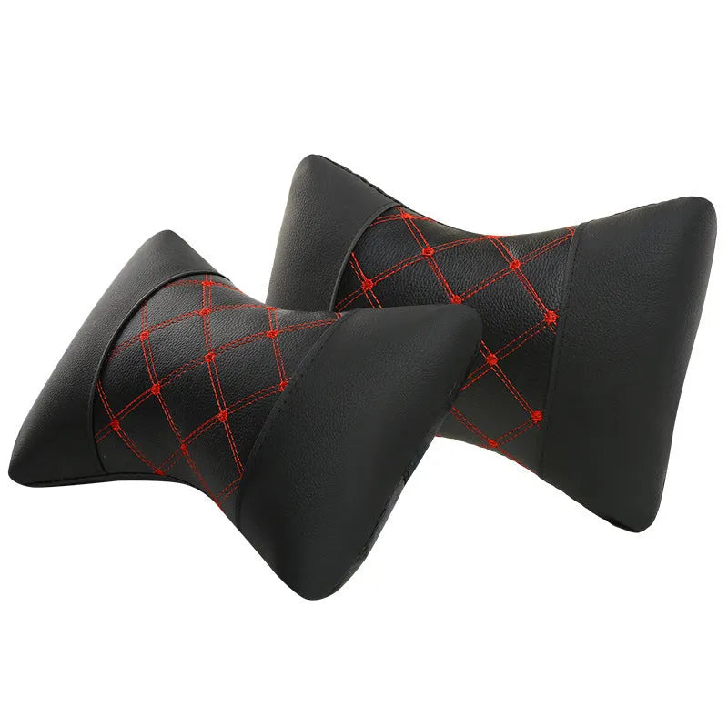 Black quilted car headrest neck pillow with diamond pattern and contrasting stitching
