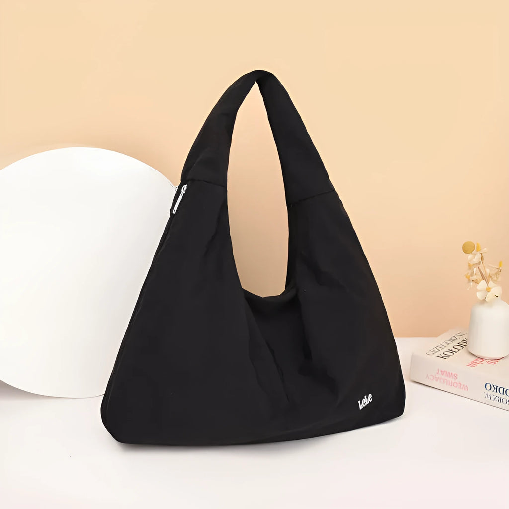 Women's heart-shaped nylon underarm bag in black, yellow, khaki, and blue colour options showing large capacity design