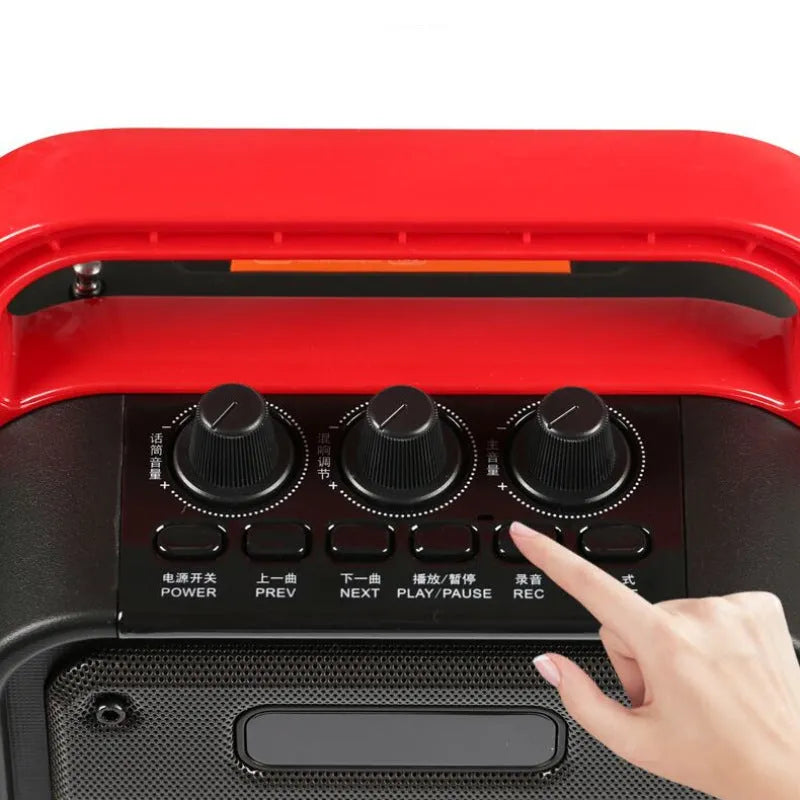 MS62AI black portable Bluetooth speaker with wireless microphone on a table.