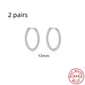Close-up of S925 sterling silver twisted string round hoop earrings in gold finish.