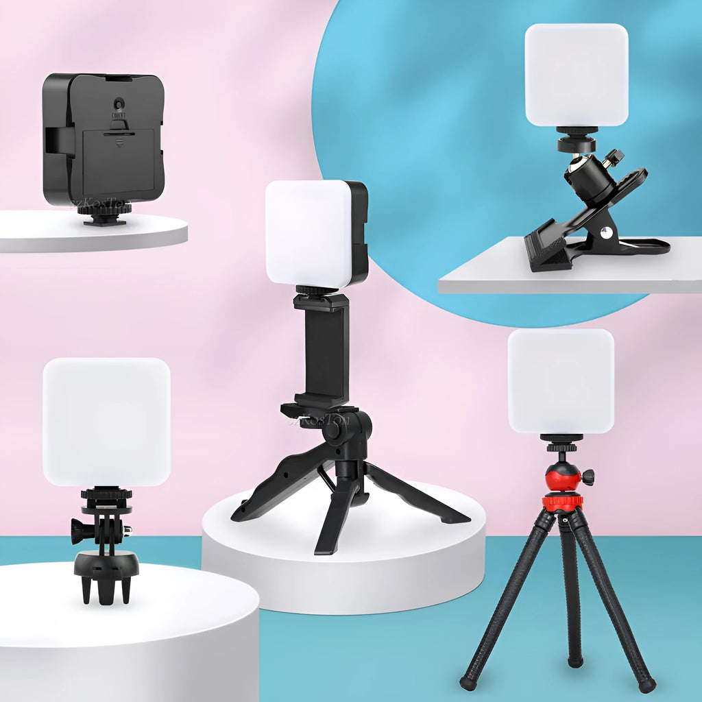 Small square LED camera flash on a mini tripod, showing rotatable head and compact size.
