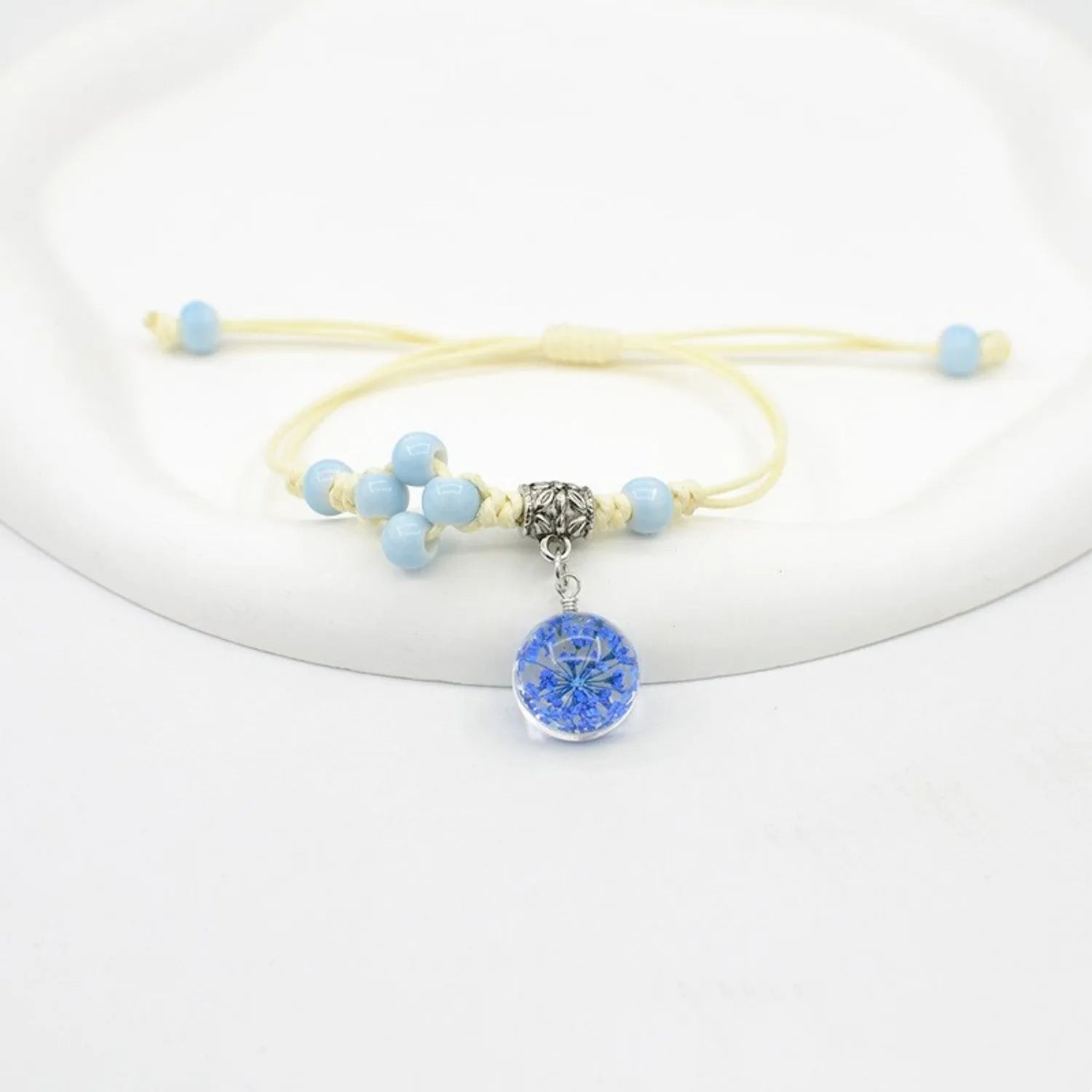 Glass bracelet with dried flowers inside 1.4cm beads on lace-style band in multiple colour options