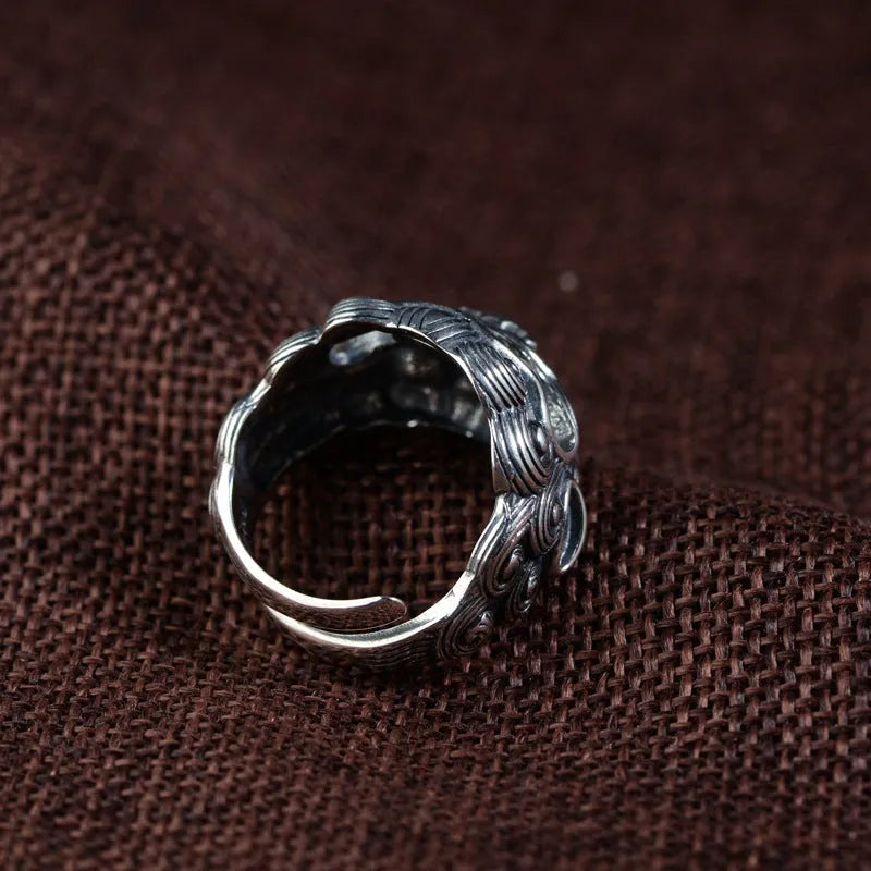Personalised Jibeast pattern open style silver diamond ring on a hand.