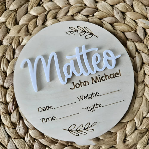 Square wooden baby name sign with birth information, 15 cm wide, in one of three style variants.