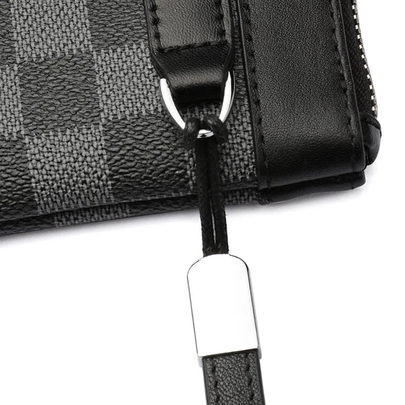 Black plaid patterned men's leather clutch wallet showing front view.