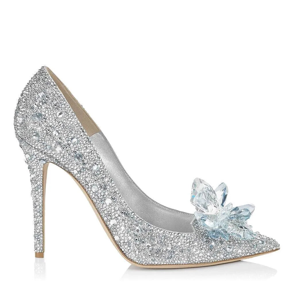 Women's gold pointed toe stiletto high heels with sequin cloth and rhinestone decoration.