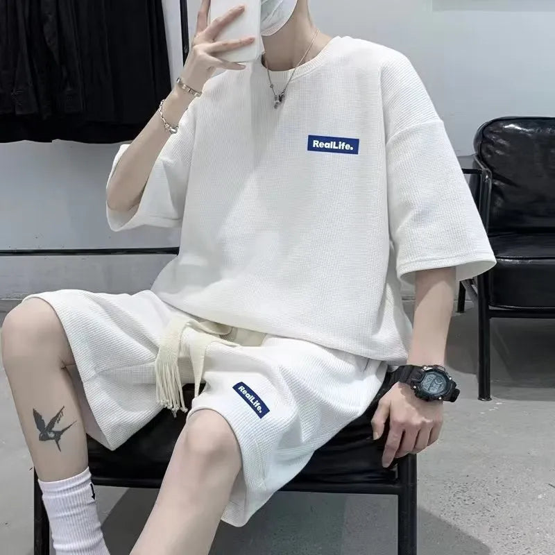 Men's waffle-textured leisure sports suit set with short sleeve top and matching shorts in cotton polyester blend fabric