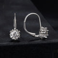Sterling silver flower bud ear clips with moissanite centre stones and white gold plating