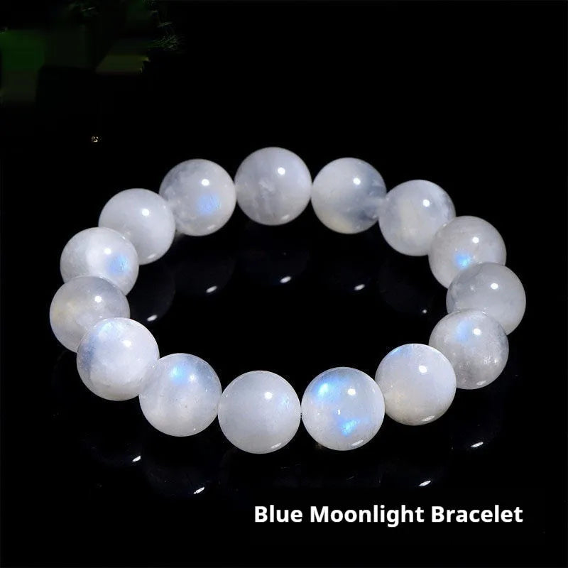 Natural blue moonlight round bead moonstone bracelet on a wrist, showing polished geometric beads.