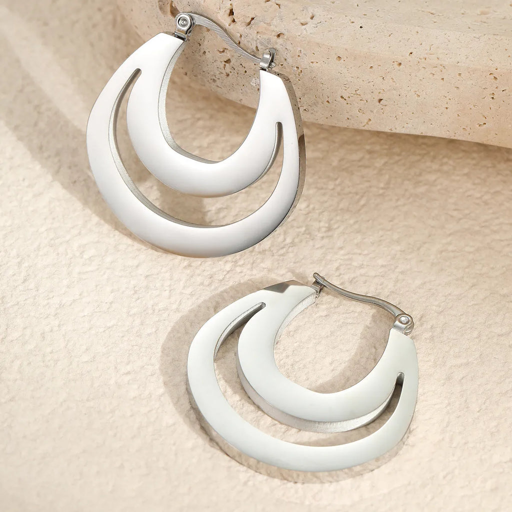 Geometric gold plated French earrings with round elements on stainless steel base