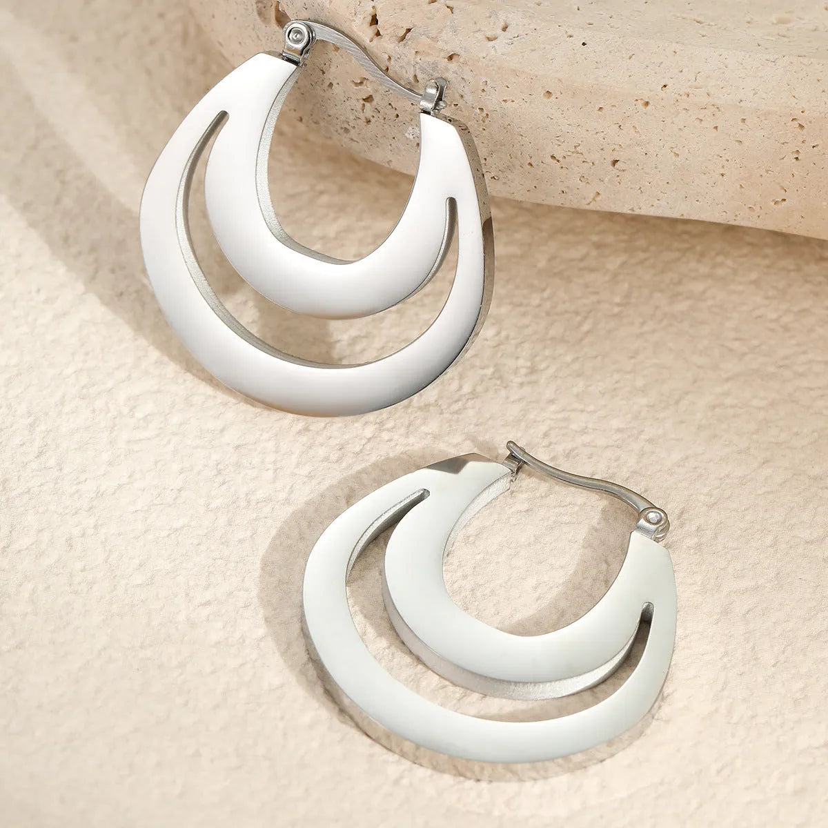 Geometric gold plated French earrings with round elements on stainless steel base