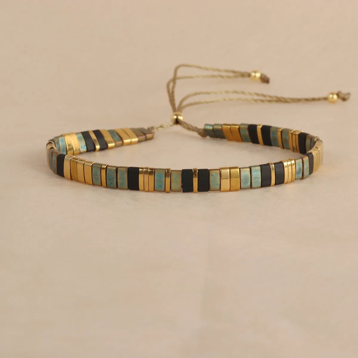 Geometric glass and coloured glaze beaded bracelet with round elements in five colour options