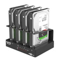 Four-bay external hard drive enclosure for 2.5-inch drives with cables and brackets
