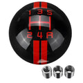 Black acrylic car gear shift knob showing 5-speed pattern with white lettering, next to three screw accessories.