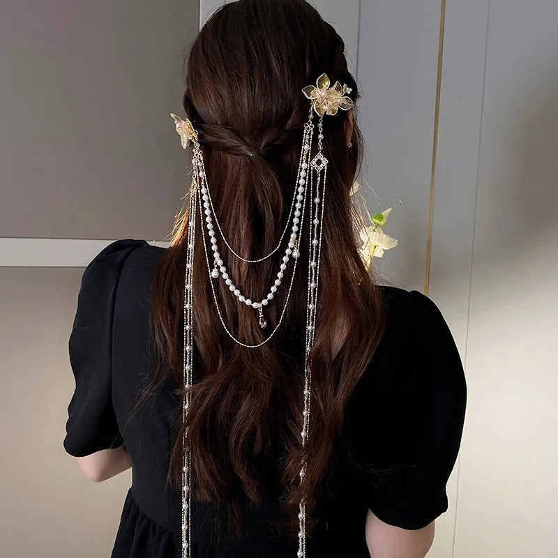 Gold grip hairpin with white pearl, clear diamond, flower decoration, and a long beaded tassel.