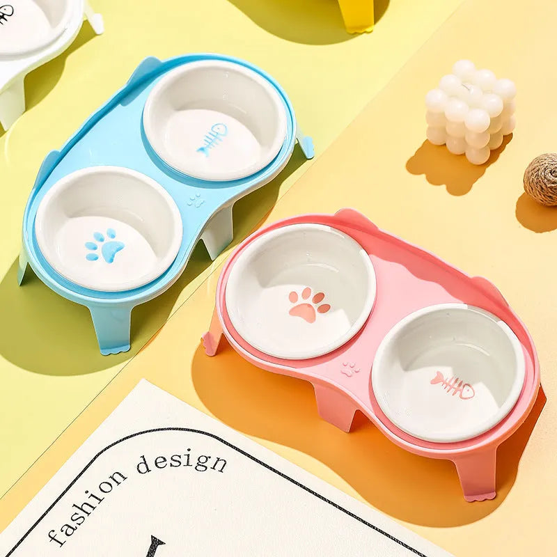 Ceramic cat food and water bowl set on tilted elevated stand in blue, pink, white or yellow colours