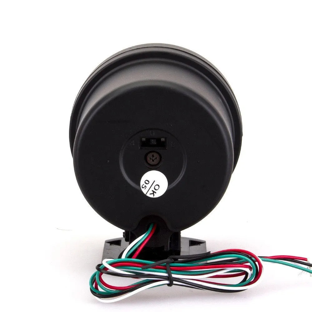 Black plastic automotive tachometer with blue-lit dial showing 0-8000 RPM scale.