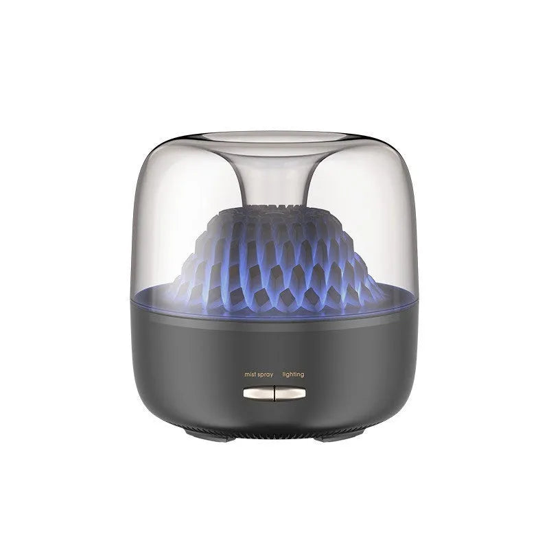 Round resin aroma diffuser with colourful light in beige, on a desktop, with a single fog nozzle