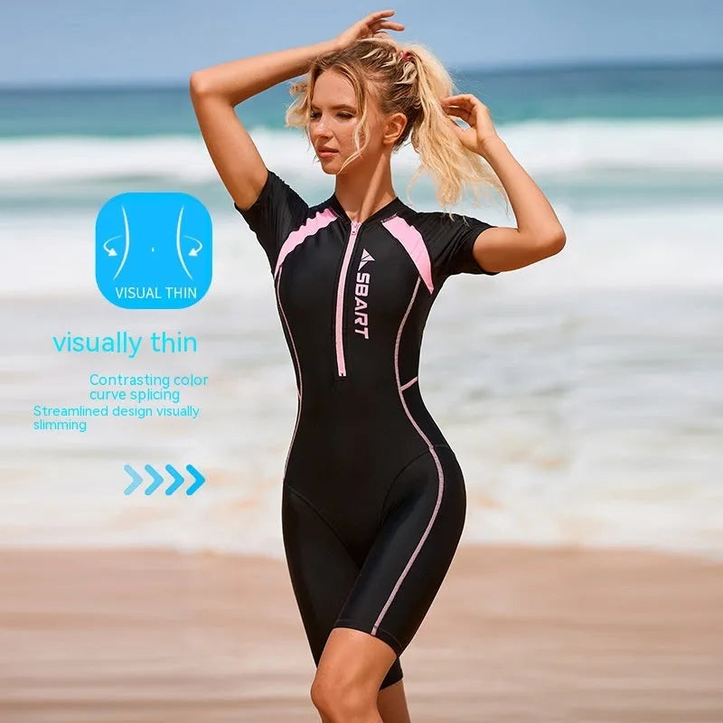 Solid colour one-piece swimsuit with short sleeves and chest pad, shown in black pink.