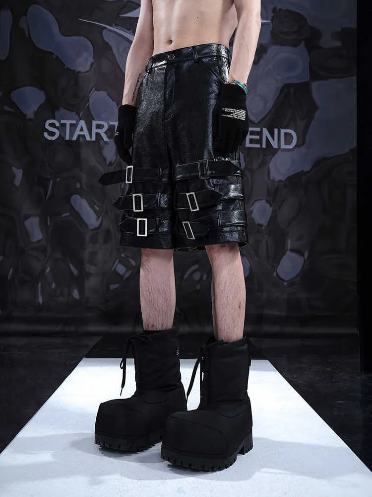 Men's black PU leather casual shorts with cropped length and mid-low waist.