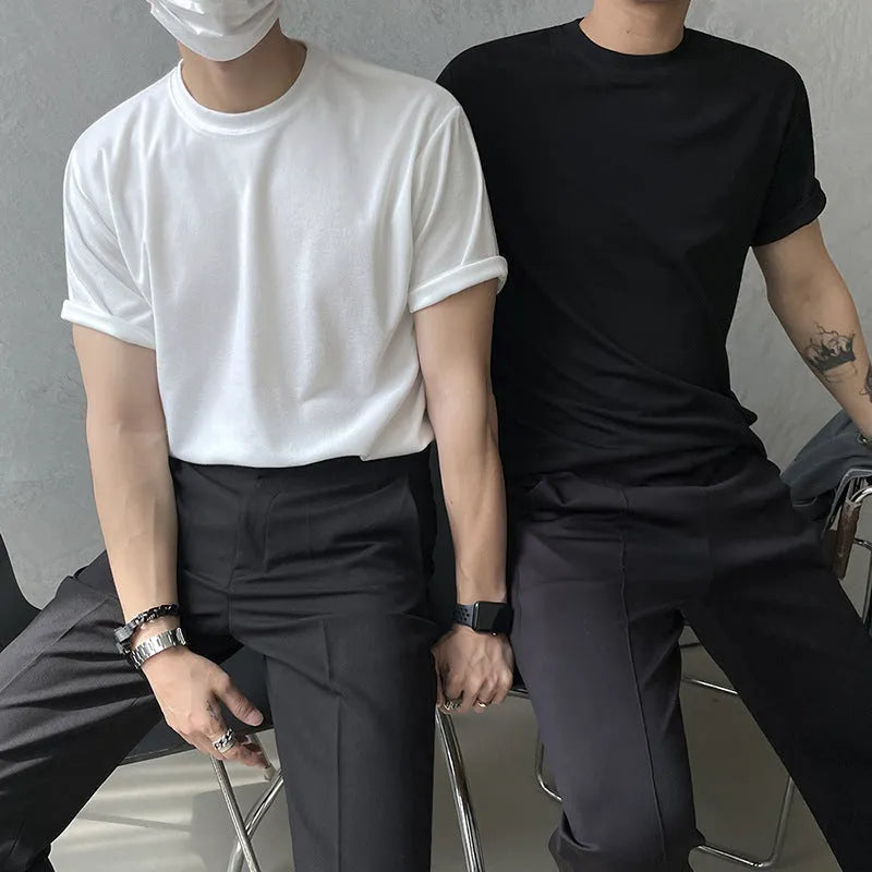Men's slim fit cotton T-shirt in black on a hanger, showing round neck and half-sleeve design.