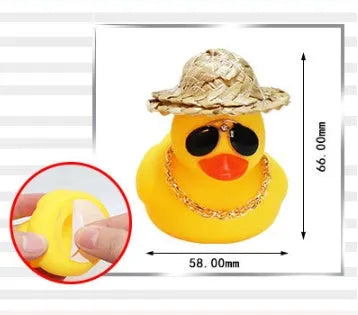 Cartoon yellow duck car ornament wearing a straw hat and sunglasses