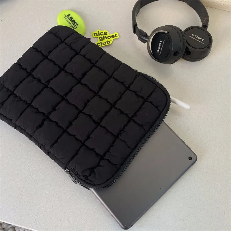 Black nylon laptop shoulder bag showing large capacity and shoulder strap