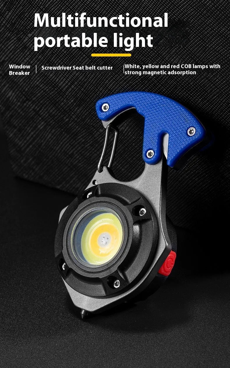 Compact silver and black keychain flashlight with multiple LEDs, a keyring loop, and a pointed window-breaking tip.