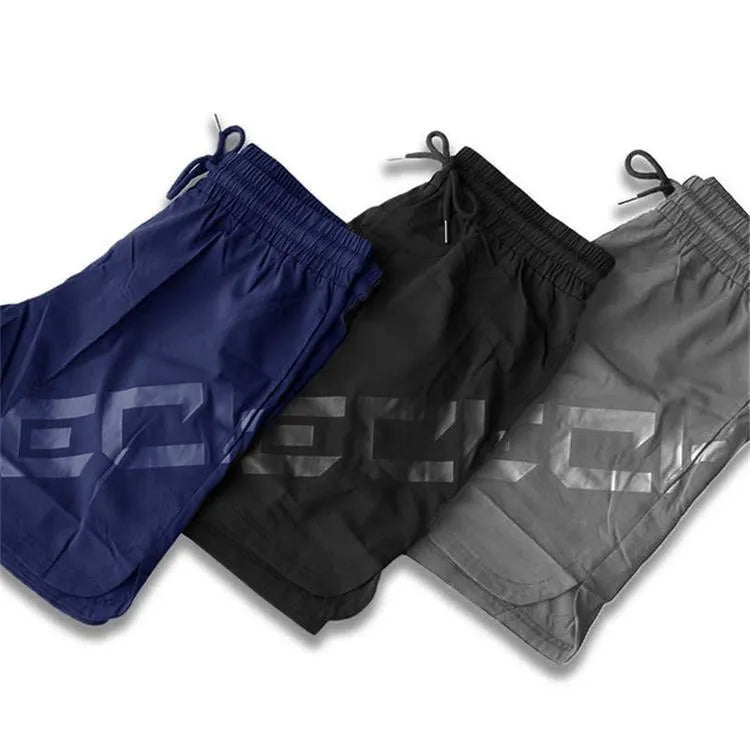 Men's black knee-length training shorts with quick-dry nylon fabric for summer running