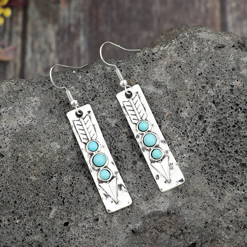 Women's silver geometric earrings with turquoise inlay detailing on long strip alloy design