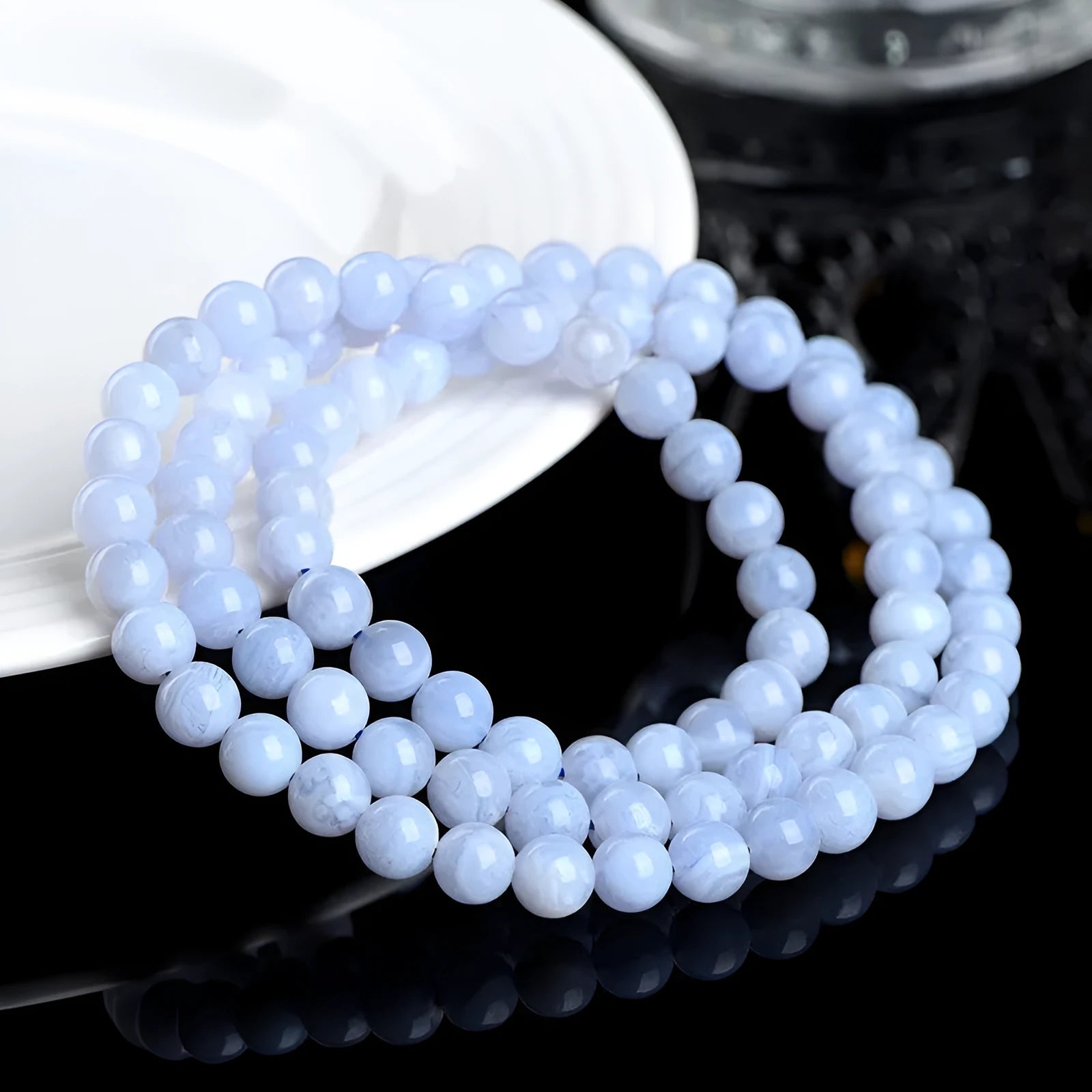 Blue agate bracelet with striped patterns showing 6-6.8mm beads and natural stone colour variations