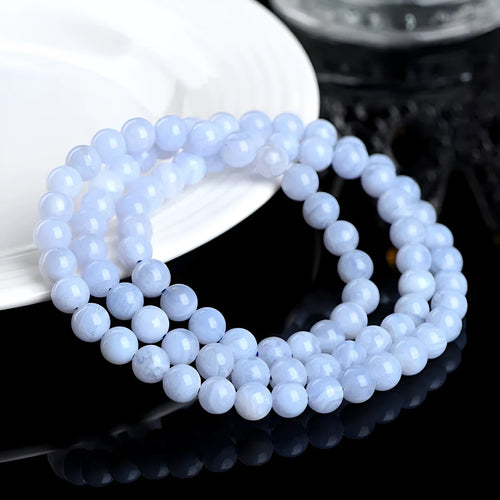 Blue agate bracelet with striped patterns showing 6-6.8mm beads and natural stone colour variations