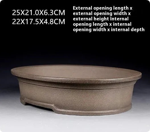 Handmade antique oval purple sand bonsai pot with dimensions 25x21x6.3 cm.
