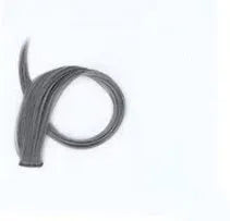 Close-up of a long, curly gradient hair extension patch in mixed silk material, showing clip fastenings.