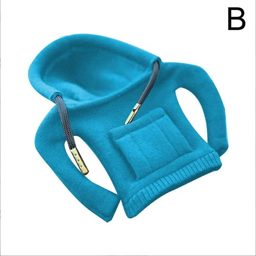 Cloth gear shift knob hoodie cover in assorted colours, shown next to a car gear stick.